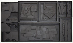 Photo of a sculpture by Louise Nevelson comprised of several wooden boxes filled with wooden objects configured together and painted black.