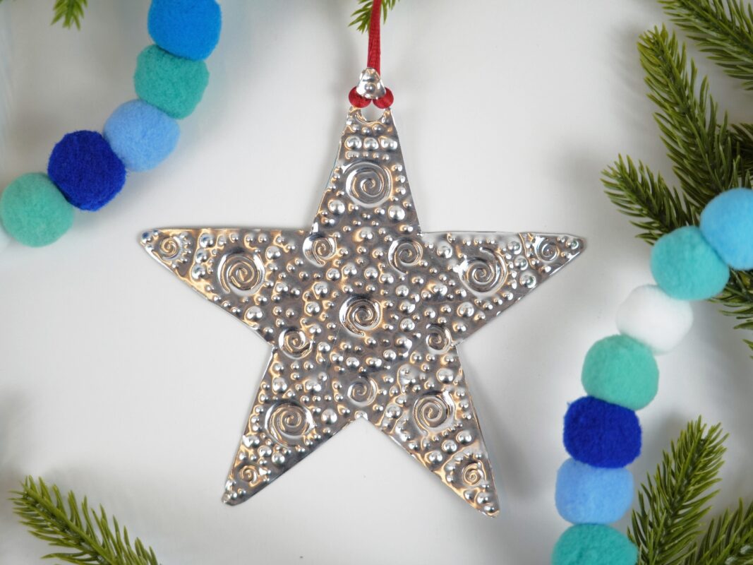 Photo of an embossed metal star ornament.