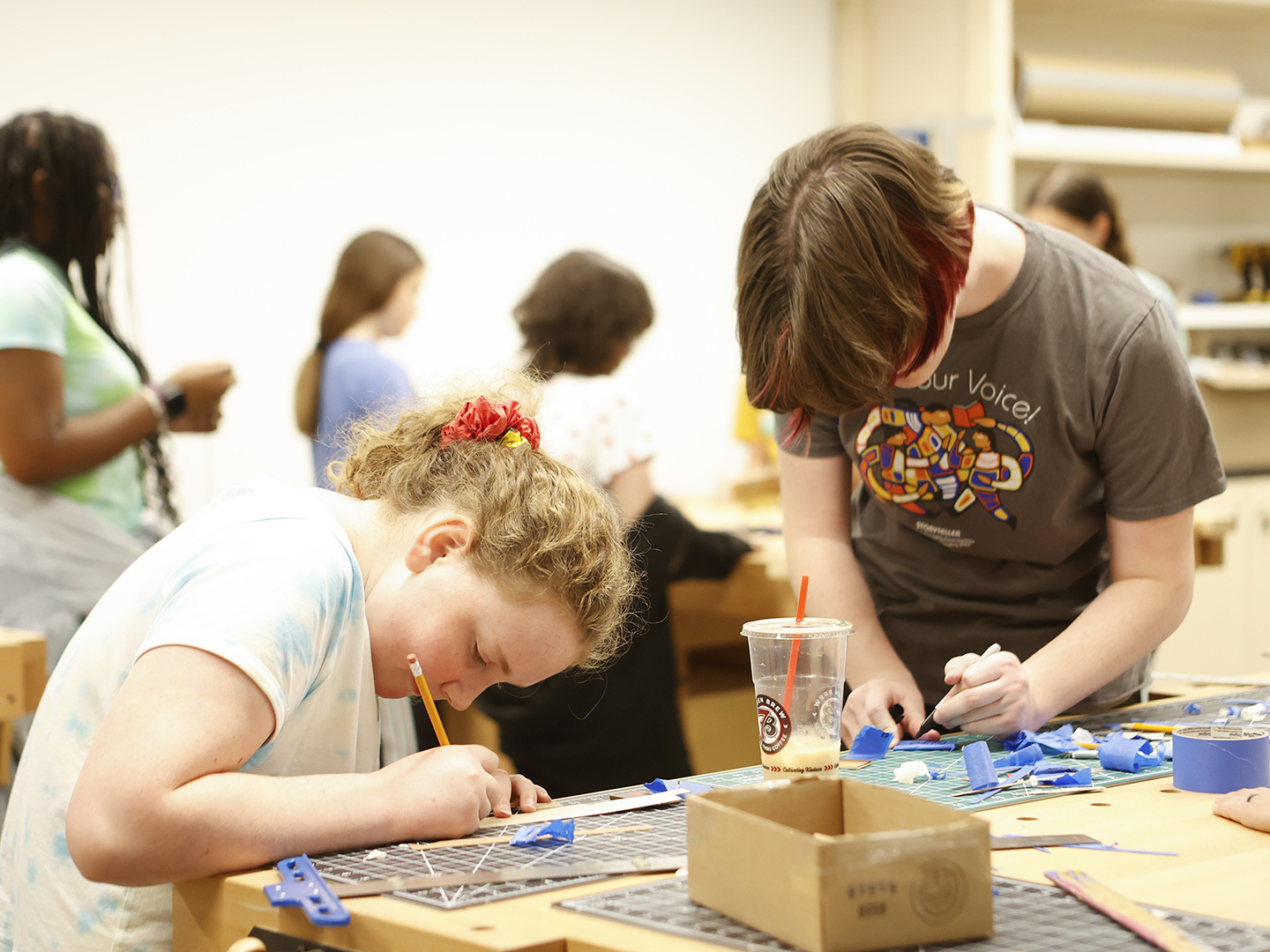 Photo of children doing crafts in an art studio in the Windgate Art School.