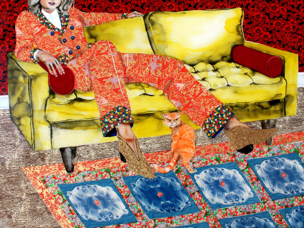 Photo of an artwork by Lisa Krannichfeld depicting a woman sitting on a yellow couch with an orange cat at her feet.