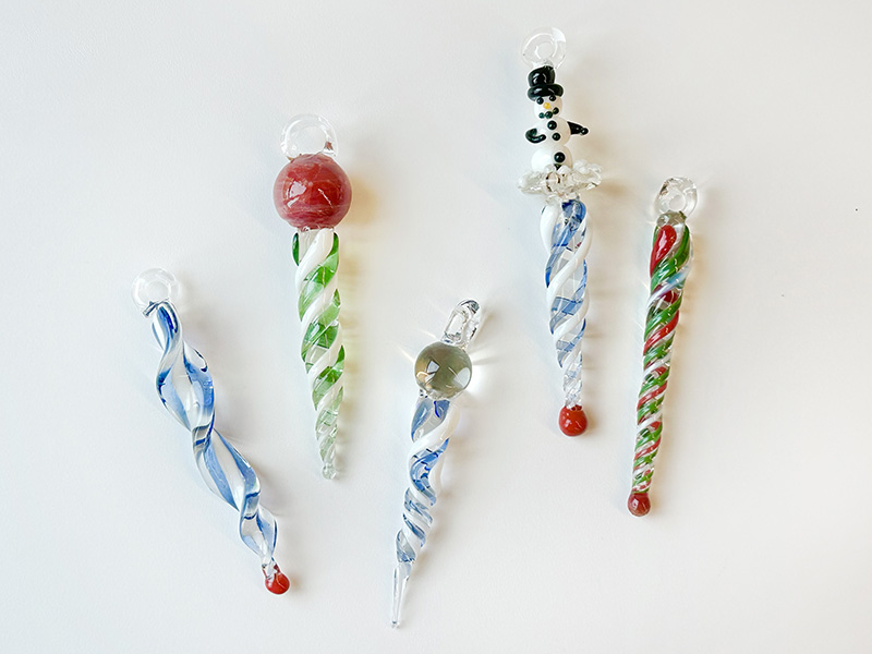 Photo of five handmade glass icicles.