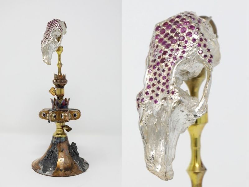 Spliced photo of a metal candlestick holder on the left. On the right is a close-up of the top of the candlestick holder featuring a silver shape inlaid with purple beads.